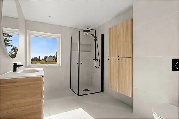 Badet er nytt fra 2026 og fremstår moderne og helhetlig, med store fliser på både gulv og vegger